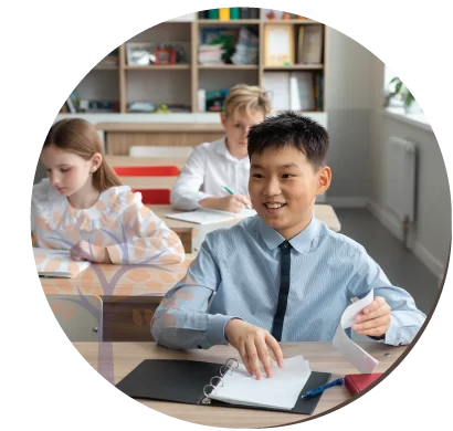 students-in-a-classroom-representing-employee-benefits-and-insurance-for-international-schools-cover-banner
